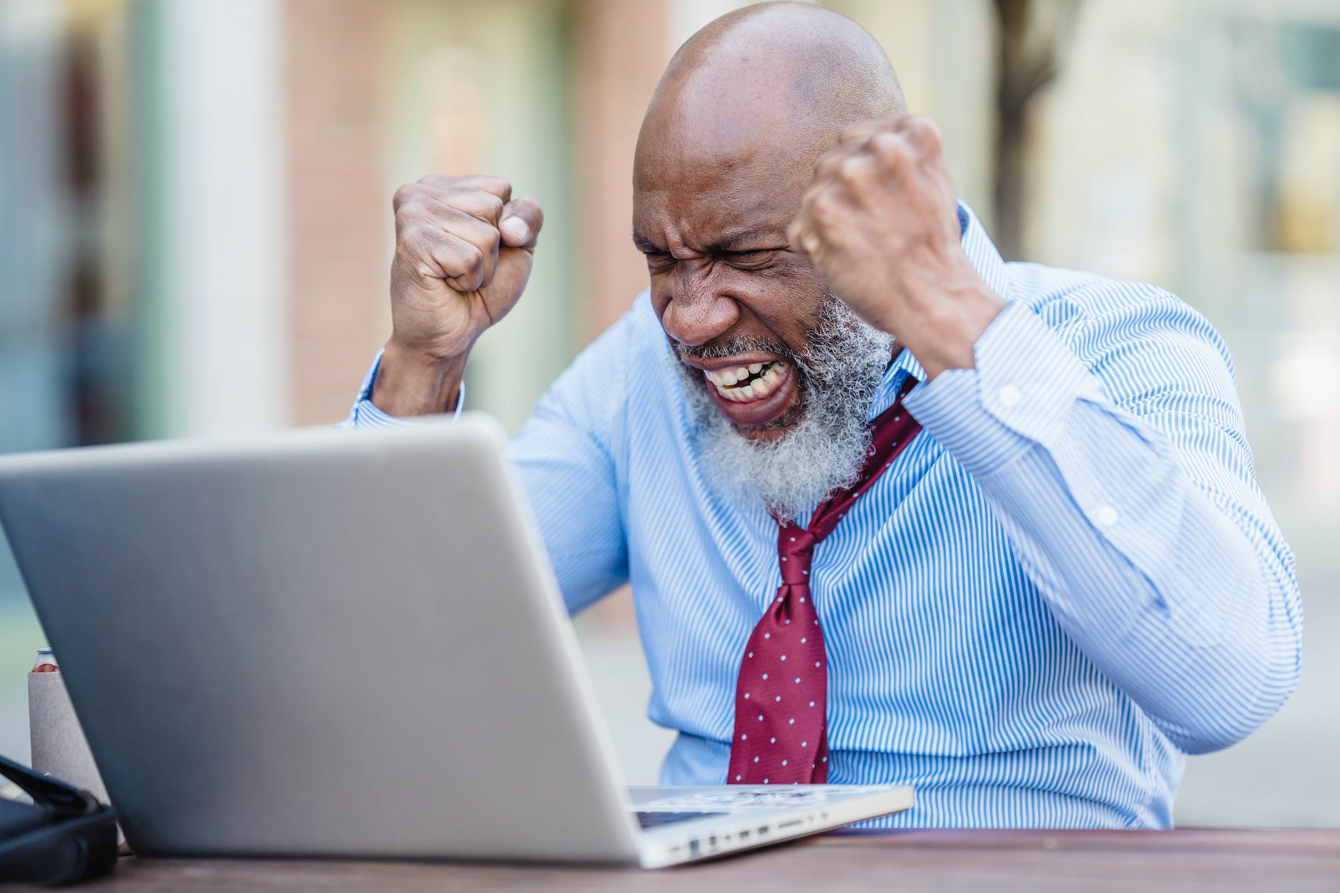 frustrated man in front of a laptop